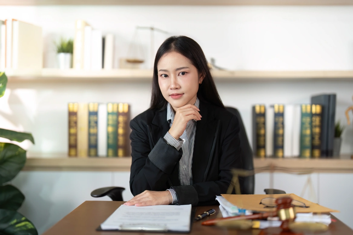 confident lawyer young female attorney posing in office with legal documents photo 1